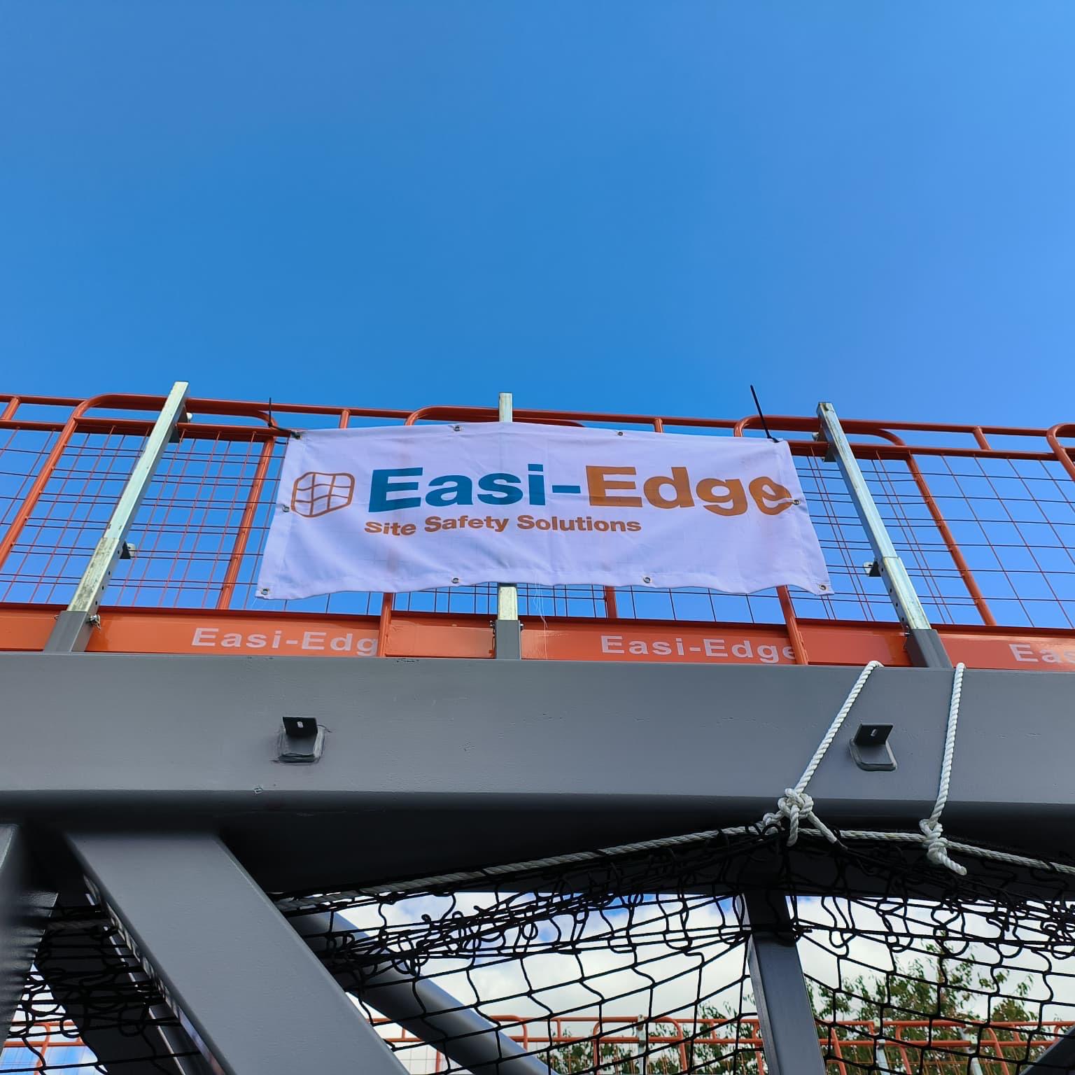 Easi-Edge on-site banner solutions shown on their edge protection barrier at the top of a bridge section